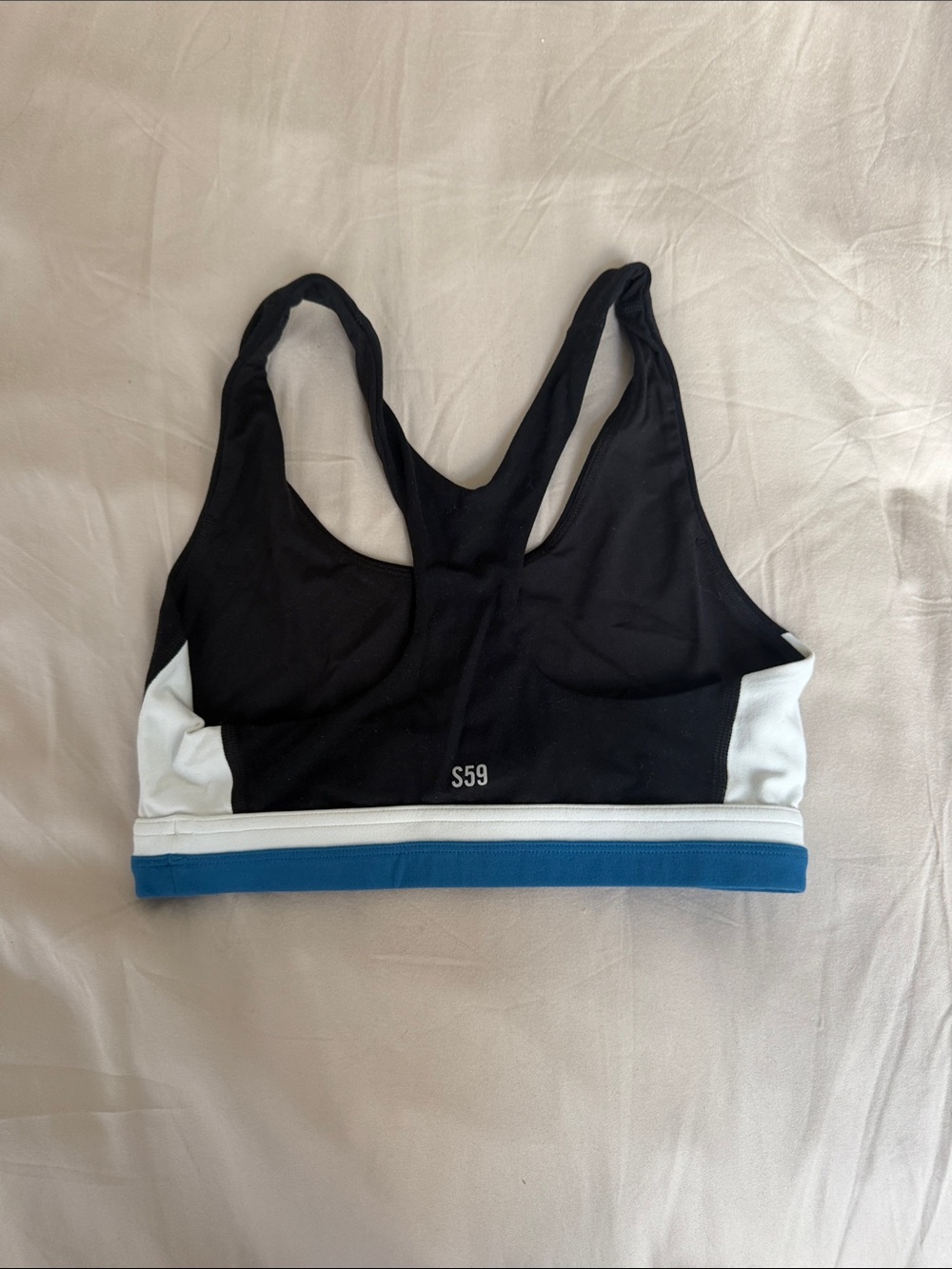 Like new size CS Splits59 Black & White Racerback Sports Bra with Blue Trim